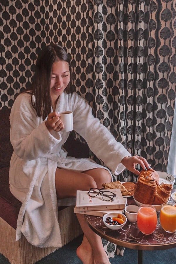 Hotel Monte Cristo Paris Review - Girl Eating Croissant
