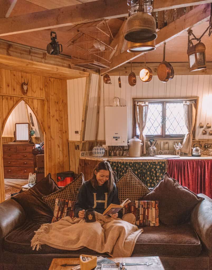 Girl Reading on Sofa in Hagrid's Cottage in North Yorkshire