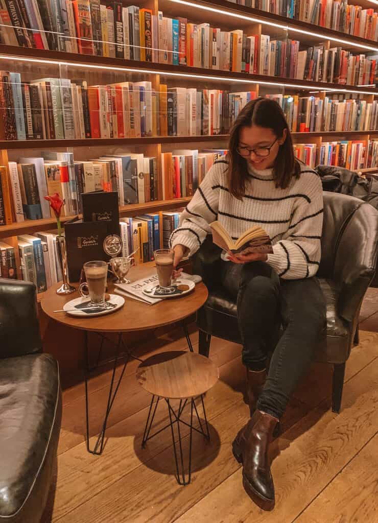 Girl reading in literary bar