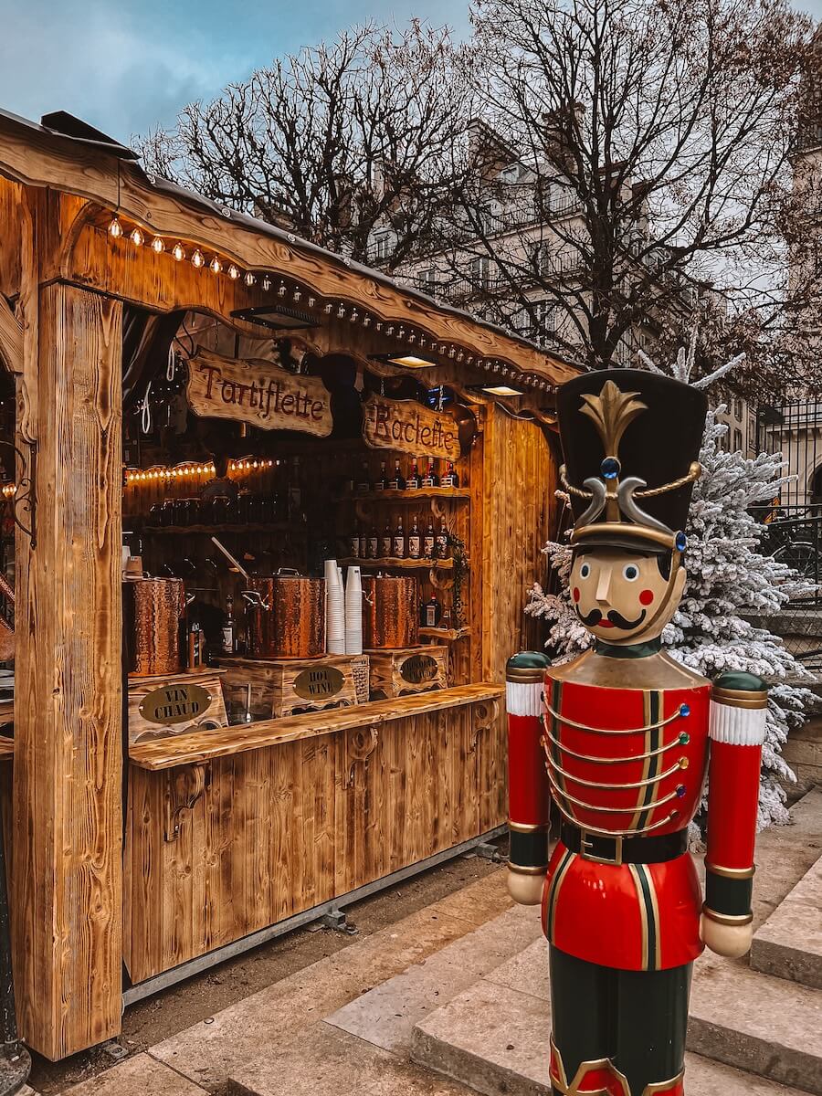 A food stall at La Magie de Noel stall in Paris, similar to the Christmas market seen in The Summer I Turned Pretty Paris scenes