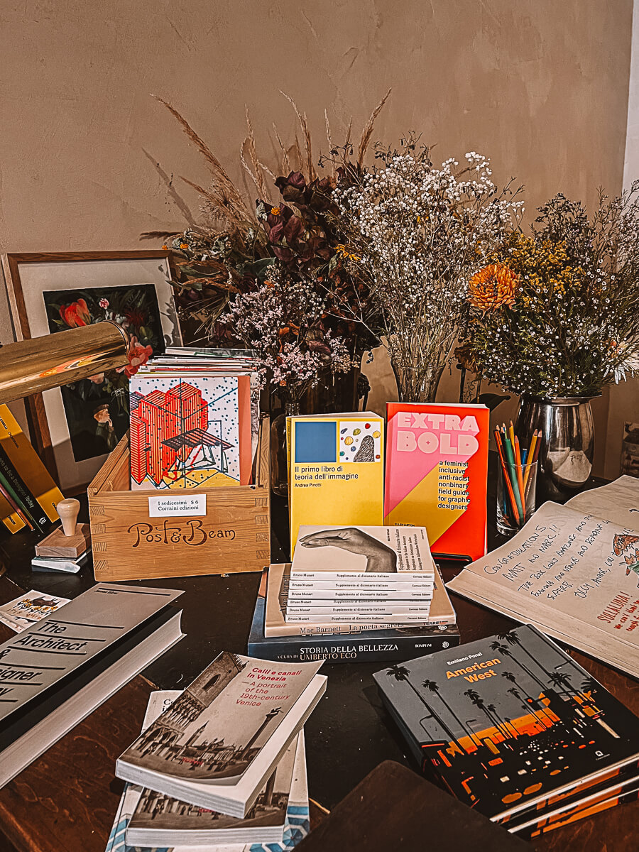 Books spread on table inside Sullaluna in New York City.