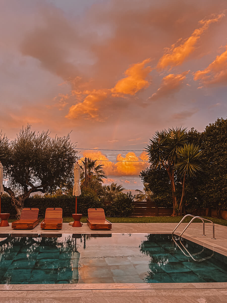 Sunset over a beautiful blue pool at Cielo Villas in Zakynthos Greece 
