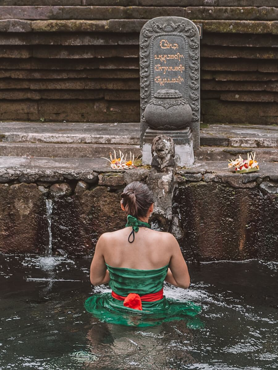 Woman washing at Tirta Empul Temple